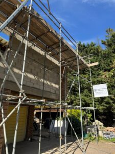 How long does it take to erect scaffolding? – This photo shows a multi-lift structure with full boarding already in place within the first day of erection by a professional team.